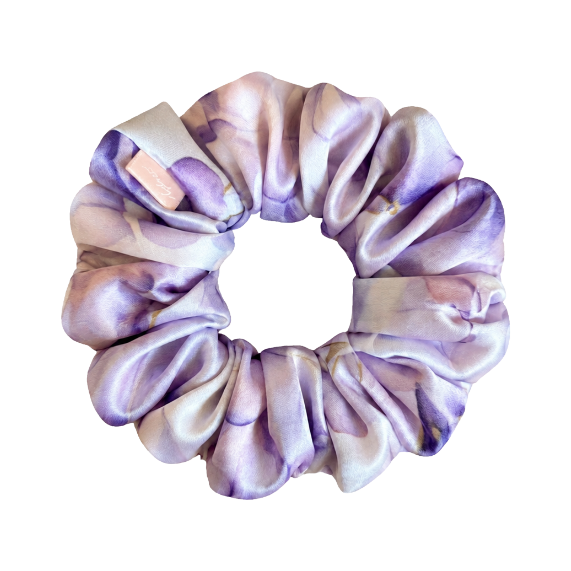 A mulberry silk hair scrunchie with a purple and lavender watercolor floral pattern, shown on a transparent background.
