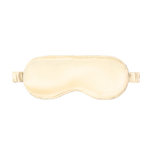 Beige silk sleep mask on a white background