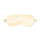 Beige silk sleep mask on a white background