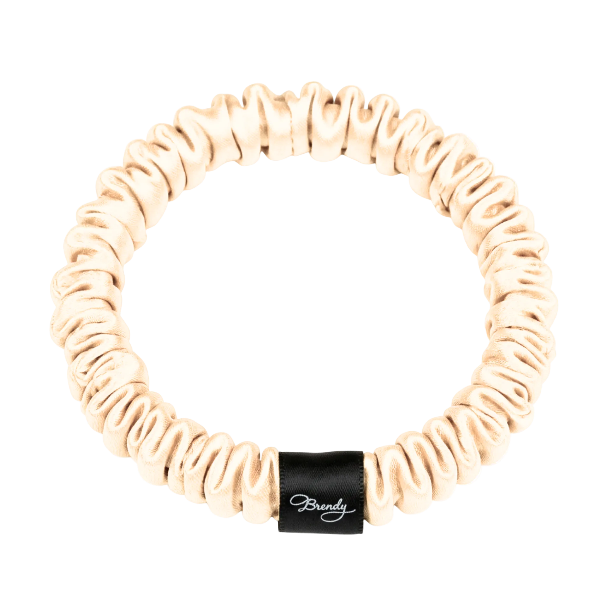 Beige skinny silk scrunchie with a black Brindy Label on a white background