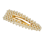 A gold-tone hair clip embellished with multiple rows of small white faux pearls, shown on a transparent checkered background.