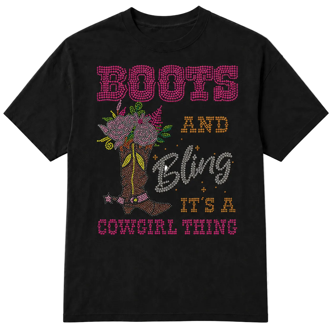 A black short-sleeve t-shirt with a western-themed rhinestone-style graphic that reads 'BOOTS AND Bling IT'S A COWGIRL THING' in pink, gold, and silver lettering, alongside an illustration of a cowboy boot decorated with flowers on a transparent background.