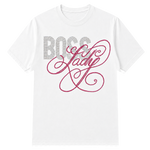 A white short-sleeve crewneck t-shirt featuring a rhinestone-style graphic on the chest with the word 'BOSS' in silver block letters and 'Lady' in pink cursive script on a tgransparent background