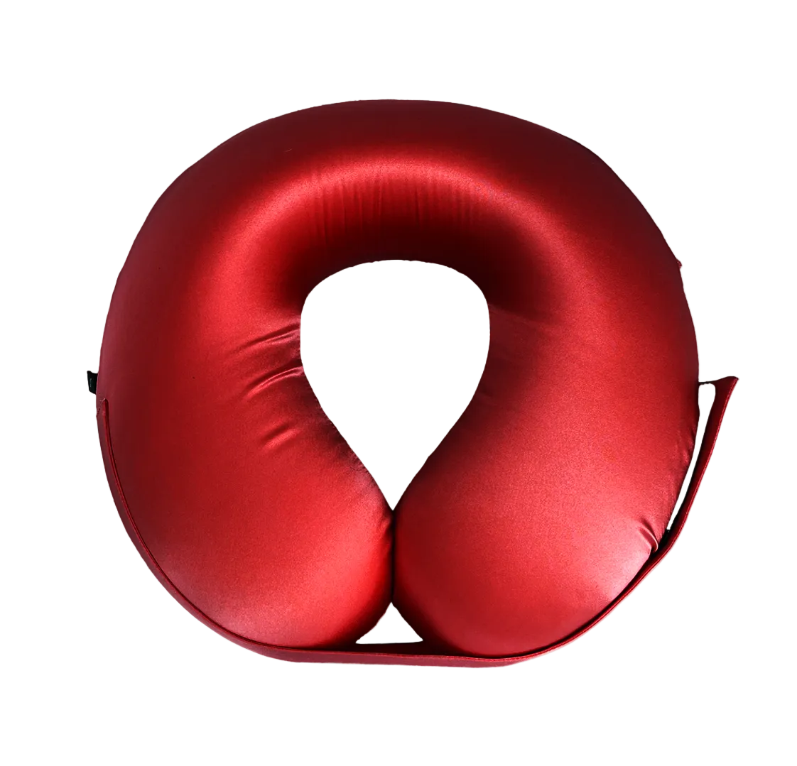 Red U-Shaped Memory Foam Travel Neck Pillow with Velcro strap on a white background