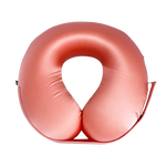 A U-shaped inflatable travel neck pillow in a coral, shown against a solid white background.
