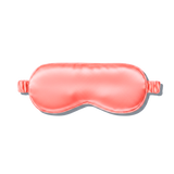 A coral pink mulberry silk sleep mask shown on a clean white background with a soft drop shadow.