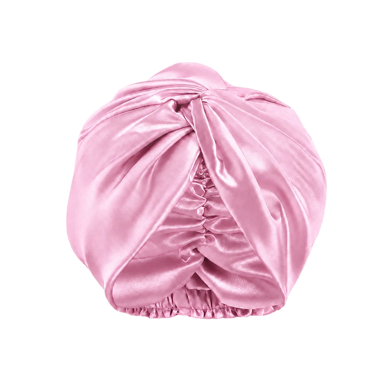A  cotton candy pink mulberry silk turban-style hair cap with a gathered ruched center and elasticized bottom, shown on a transparent checkerboard background.