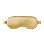 Gold silk sleep mask on a white background