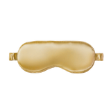 Gold silk sleep mask on a white background