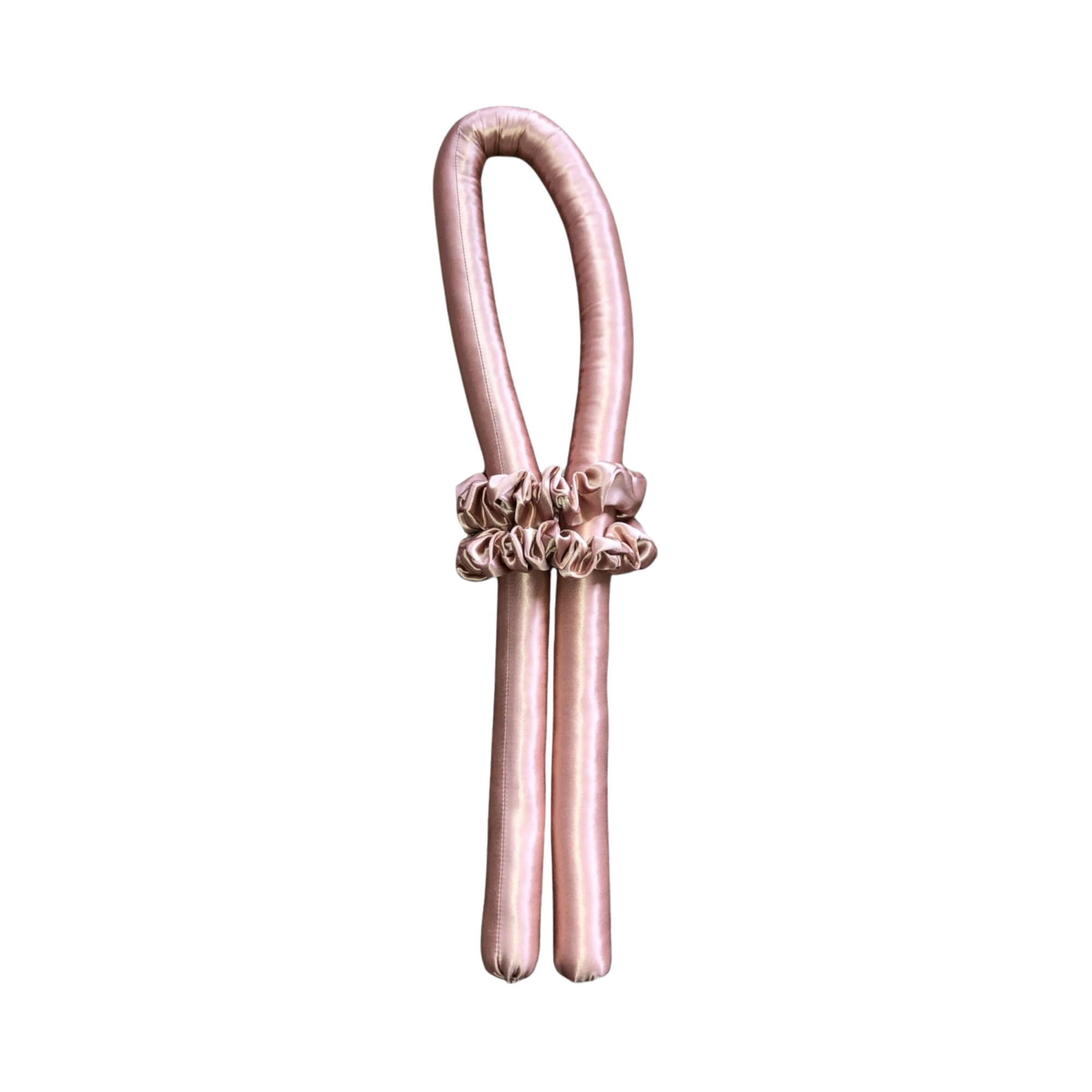 Rose Gold Heatless Hair Rollers with two silk scrunchies wrapped around them on a white background