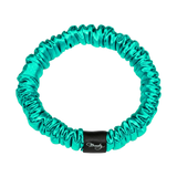 Jade Green skinny silk scrunchie with a black Brindy Label on a white background