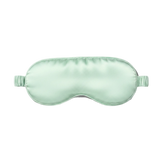 Mint green silk sleep mask on a white background