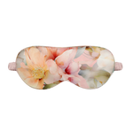 Peach Floral patterned silk sleep mask on a white background