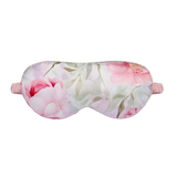 Pink Floral patterned silk sleep mask on a white background