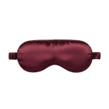 Plum silk sleep mask on a white background