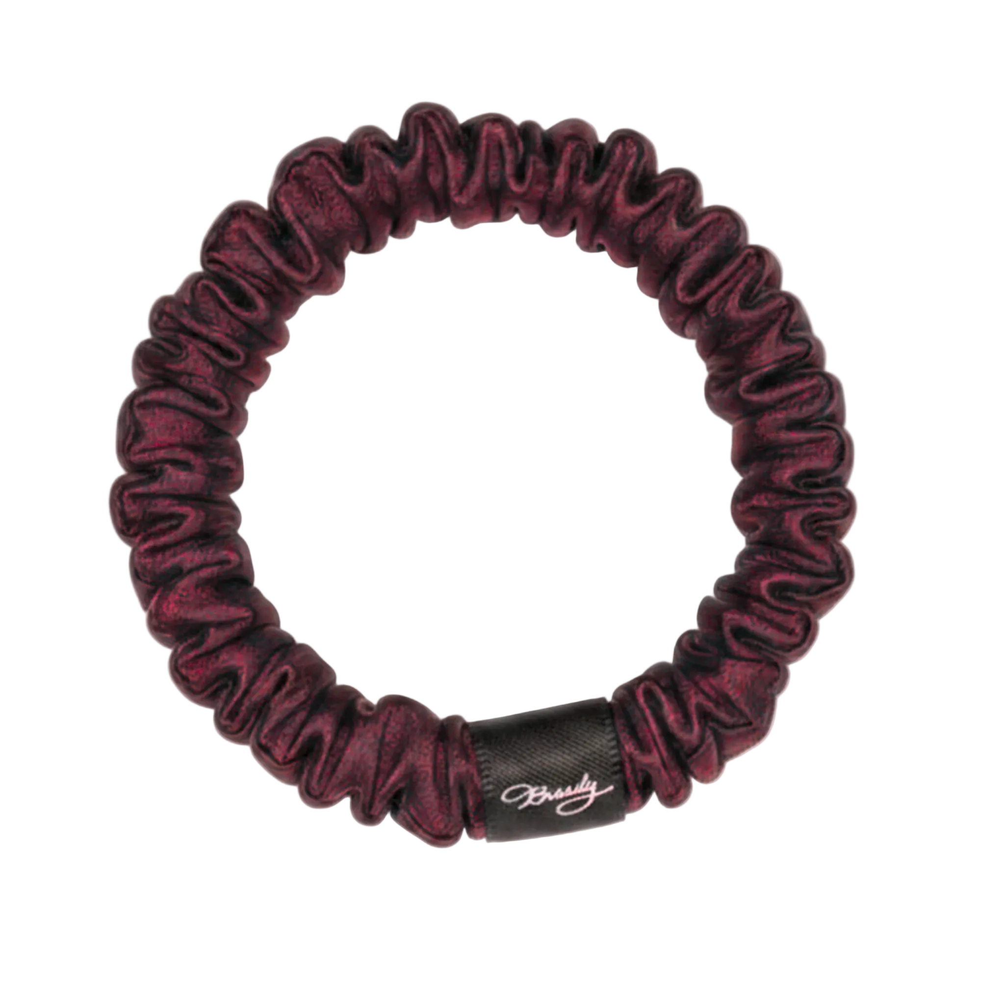 Plum skinny silk scrunchie with a black Brindy Label on a white background