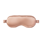Rose gold silk sleep mask on a white background