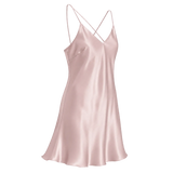 A rose pink mulberry silk slip dress with thin crisscross spaghetti straps and a V-neckline, shown against a transparent checkered background.