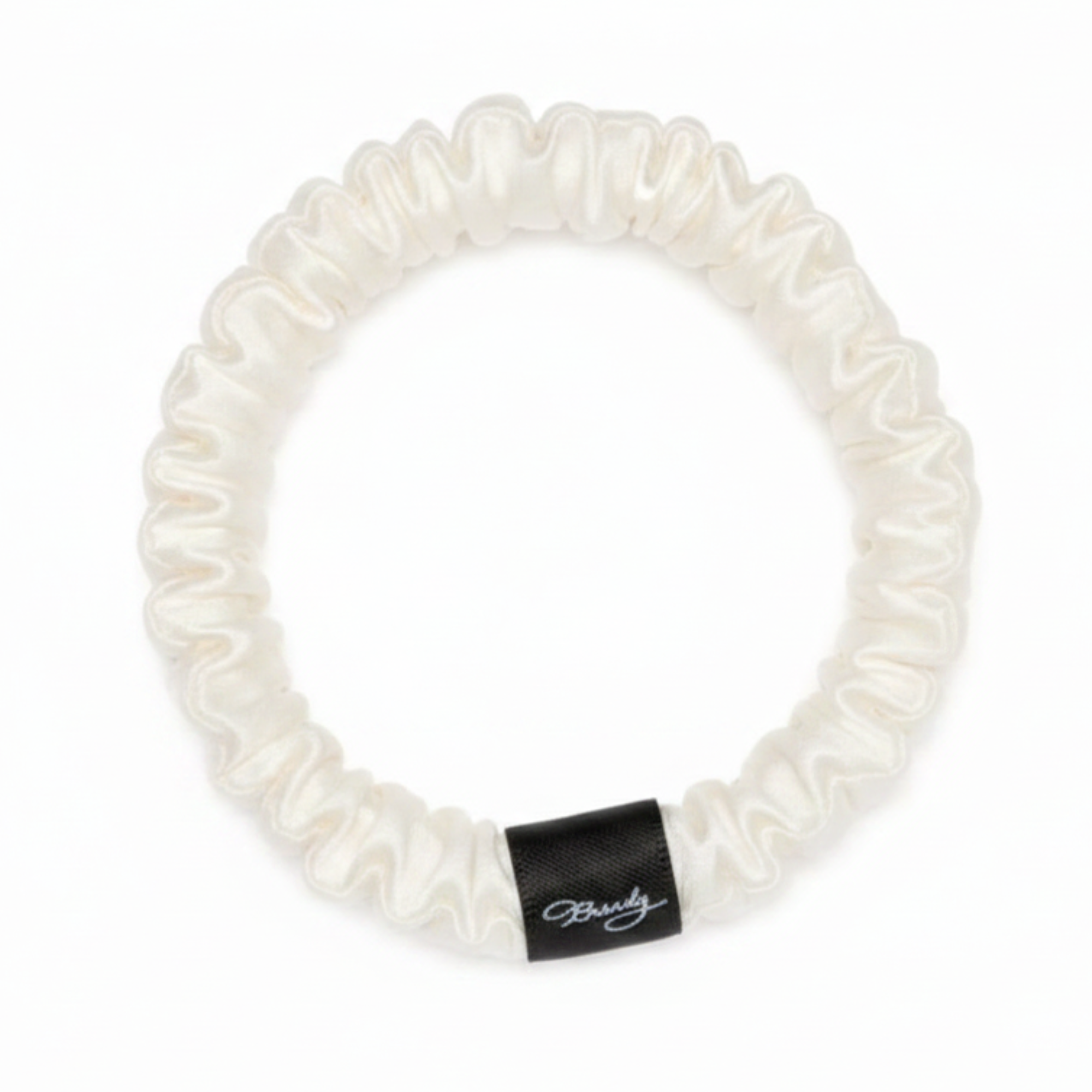White Ivory skinny silk scrunchie with a black Brindy Label on a white background